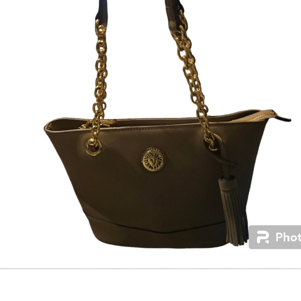 Anne Kline tan shoulder bag. NWOT it looks darker in the pics. It's tan